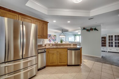 Kitchen with a tray ceiling, stainless steel appli