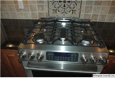 A cook's dream stove!  All top of the line GE Cafe