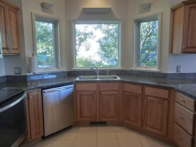 Bay window sink area looks into trees