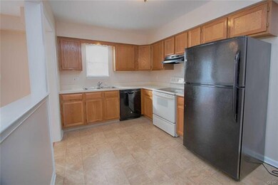 Kitchen with smooth top range,dishwasher,refrigera