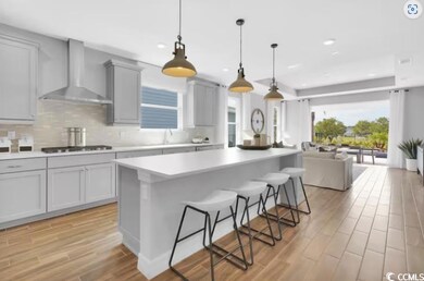 Kitchen featuring a kitchen breakfast bar, wall ch