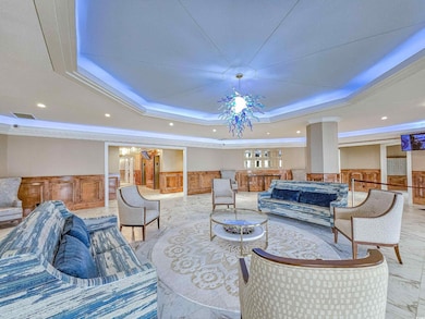 Lobby featuring wainscoting, ornamental molding, and recessed lighting