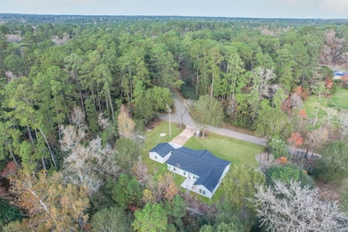 Gorgeous lot with lush green grass and mature trees showcasing vibrant fall colors—an absolutely serene setting.