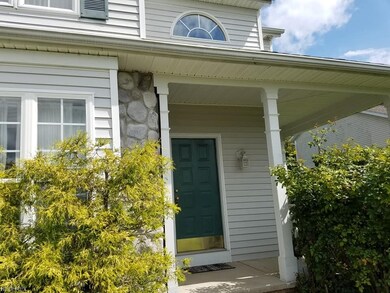 Front porch of this 15 year young home with stone 