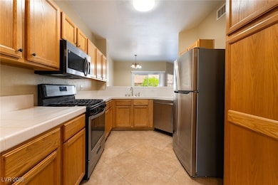 Kitchen featuring appliances with stainless steel