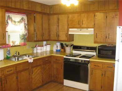 Kitchen. Open and bright kitchen/dining area - portable dishwasher conveys!