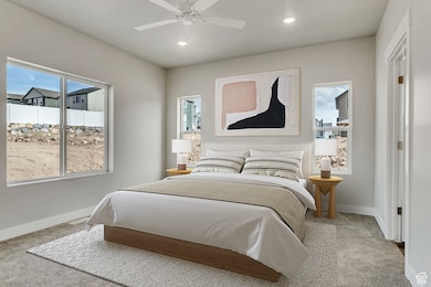 Carpeted bedroom featuring recessed lighting and ceiling fan