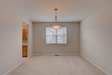 Formal dining open to the living room for easy ent