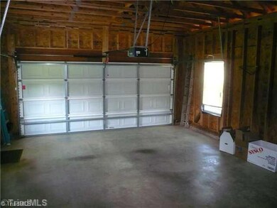 Other. Inside view of oversized attached garage.