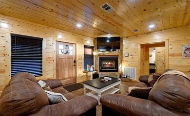 Living room featuring wooden ceiling, hardwood / w