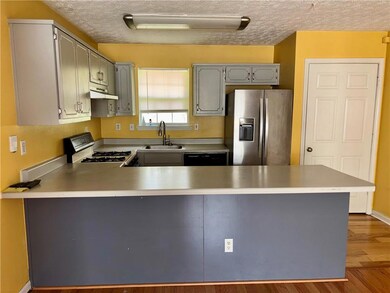 Kitchen featuring a sink, stainless steel fridge w