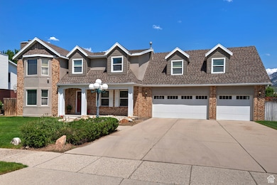 View of front of home with concrete driveway, brick siding, roof with shingles, and an attached garage