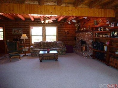 Large, open living room with windows to enjoy wond