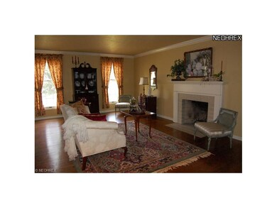 Gleaming hardwood in the living room is carried on