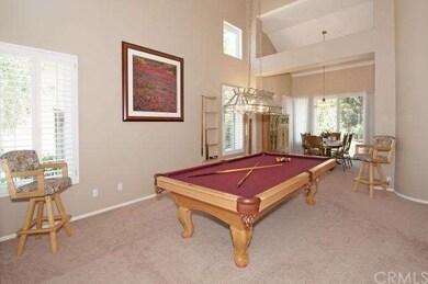 Large living room is currently has the pool table 