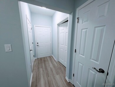 Hallway featuring light hardwood / wood-style floo