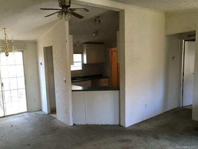 View toward kitchen from living area.  Master bedr