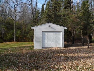 Overhead door on the shed allows for easy access t