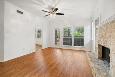 Unfurnished living room featuring a ceiling fan, 