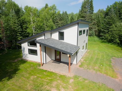 View of front of home with a patio and a front law