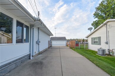 View of terrace with a garage and central air condition unit