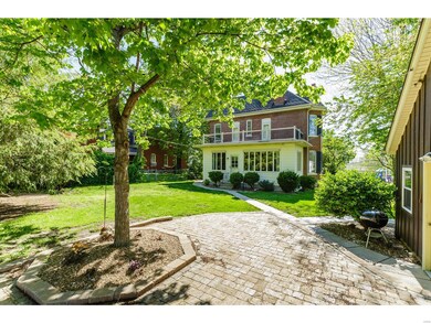Rear Elevation and Walkway to the Garage and Patio