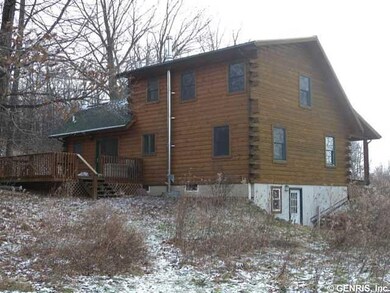 Exterior Back. Here is a winter view of the log ho