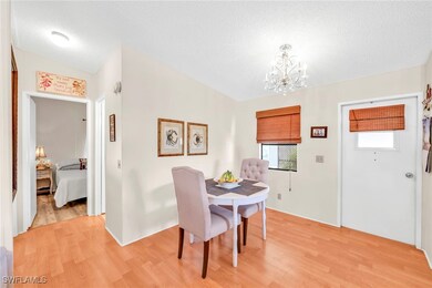 Dining area featuring light wood-type flooring, a