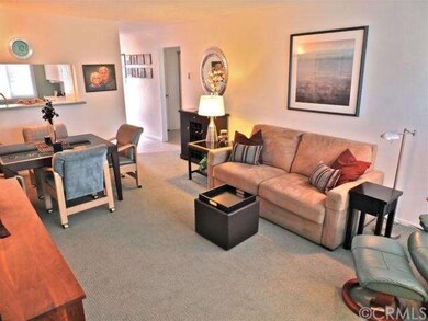 View of the living room looking back toward the en