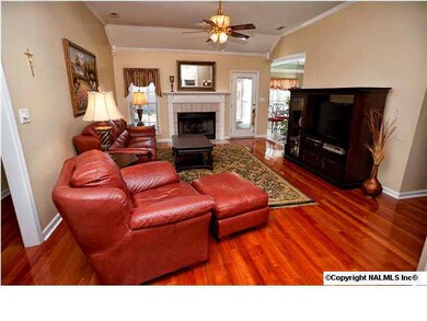 Rosewood solid hardwood floors throughout this charming home