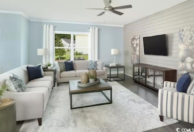 Living room featuring ornamental molding, baseboar