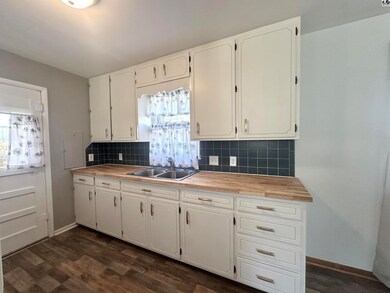 New kitchen counter top, new paint, new cabinet ha