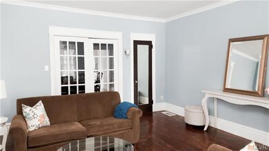 Living Room opens to Dining Room through French Do