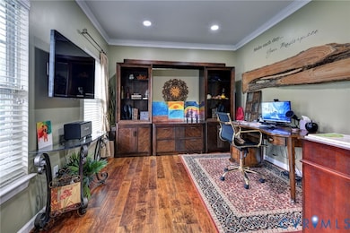 Office area featuring crown molding, wood finished floors, and recessed lighting