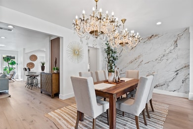 The formal dining room boasts ample natural light