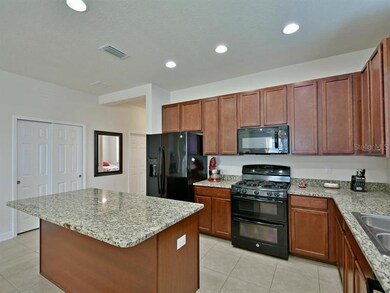 Granite counters, walnut cabinetry, large pantry c