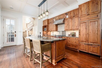 Handsomely upgraded with wall of French doors for alfresco dining