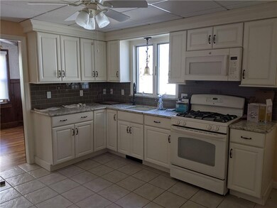 Newer granite kitchen with granite counters and ti