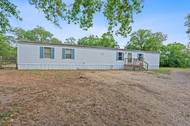 Manufactured / mobile home featuring a deck