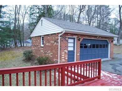 24 x 24 garage with workshop space, auto door, and