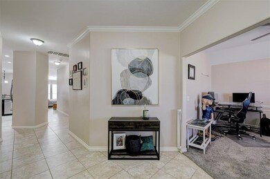 Bright open entryway with the office/flex room to 