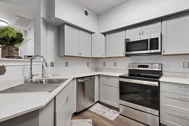 Kitchen featuring appliances with stainless steel