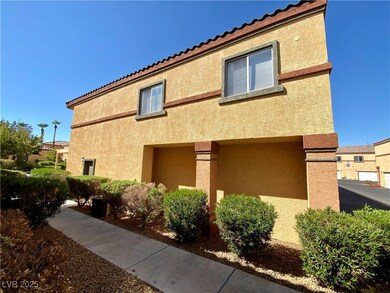 View of side of property featuring a tile roof and