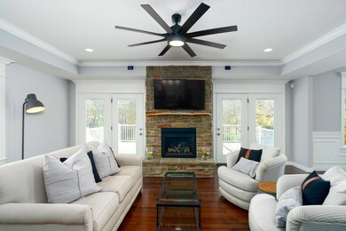 Double doors flank the stone Fireplace
