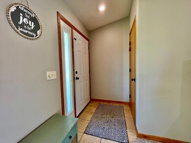 Front entrance with coat closet directly across from the main door.