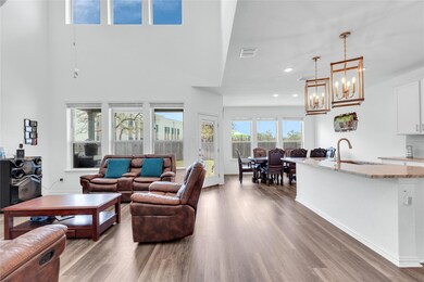 Living area featuring visible vents, wood finishe
