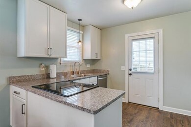 granite counters and access to backyard from this level.