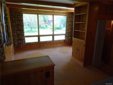 back wall of family room with full wall of windows