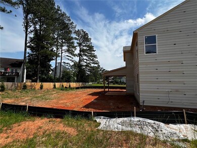 Gorgeous backyard featuring a covered patio. Great for summer BBQ's! *Photo of actual home