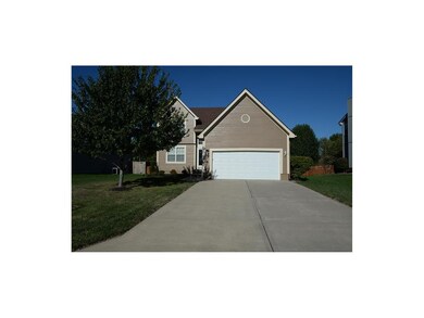 Nice wide driveway and newer garage door.